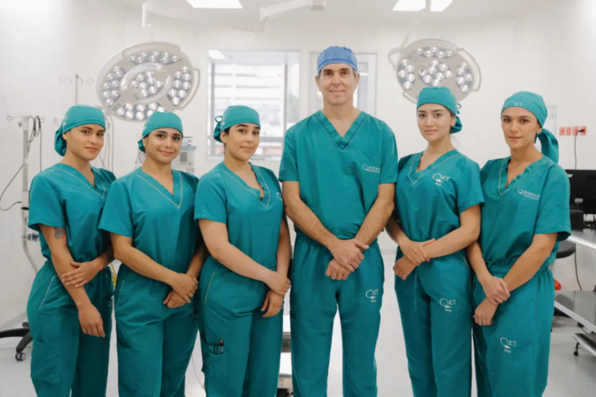 Dr. Mclean with his surgical team in a modern operating room